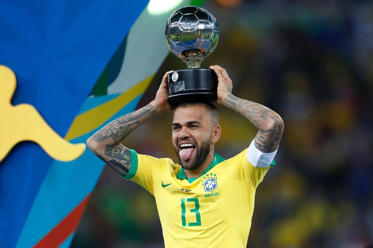 Dani Alves of Brazil celebrates with his trophy after winning the Copa America Brazil 2019 Final match between Brazil and Peru at Maracana Stadium