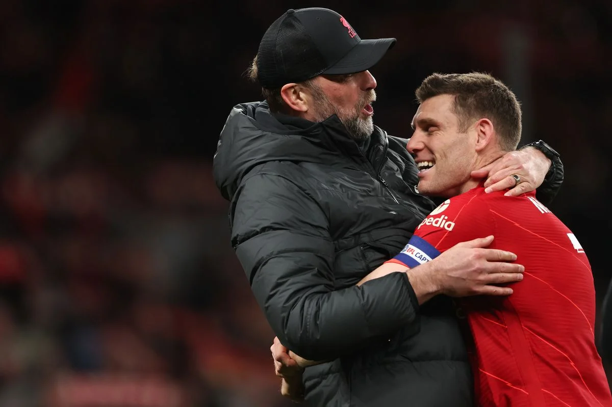 Jurgen Klopp the manager of Liverpool and James Milner of Liverpool hugging during the Carabao Cup Final match between Chelsea and Liverpool